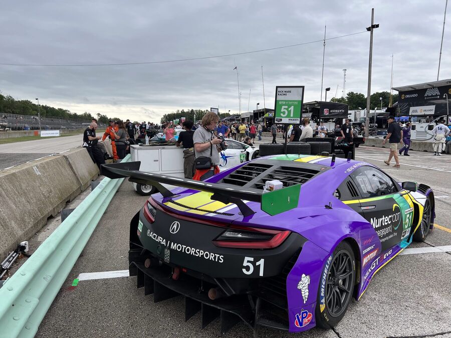 Acura NSX GT3 Evo parked behind the pit wall